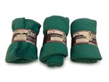 trois rouleaux de tissu vert sont empilés les uns sur les autres