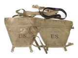an image of a pair of old canvas bags sitting on top of a white surface