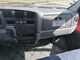 a dashboard of a car with a steering control