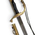 an old sword with a gold handle and a black handle