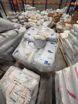 a large amount of bags and boxes in a warehouse