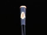a close up of a baseball bat on a black surface