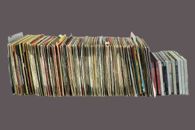 a lot of records stacked on top of each other