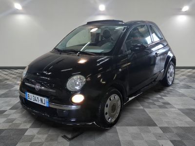 a picture of a small black car parked in a garage