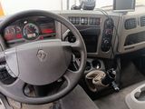 dashboard of a truck with a steering wheel and dashboard controls
