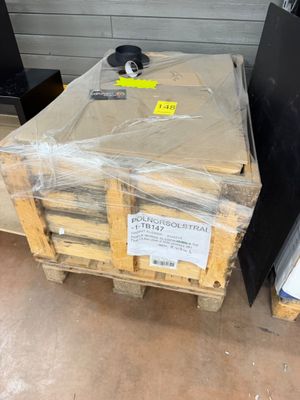 a stack of boxes and pallets sitting on a pallet
