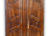 an image of a wooden armoire with two doors and a gold handle