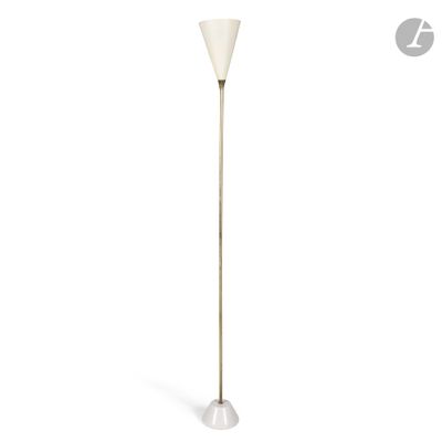 a white floor lamp with a white shade on top of it