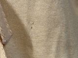 a close up of a shirt with a button on it