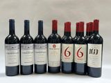 six bottles of wine are lined up in a row