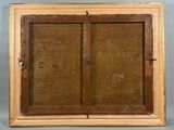 an old wooden frame with two open doors on top of it
