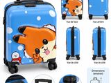 une photo d'une valise bleue sur laquelle figure l'image d'un chien