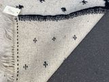 rug with black and white stars on it laying on the floor