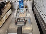 a close up of a fryer in a commercial kitchen