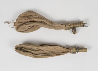 pair of antique wooden handles with metal handles on a white surface