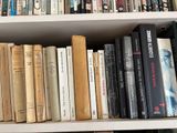 many books that are on the shelves in the room