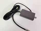 a close up of a power cord and a charger on a white surface