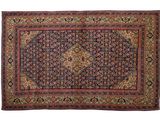 un ancien tapis persan à motif de médaillon