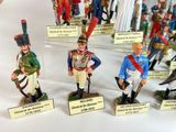 several figurines of soldiers are displayed on display in a glass case