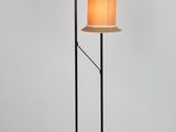 a pair of floor lamps on a white background with a white wall
