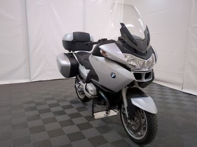 a motorcycle that is parked on a black and white checkered floor