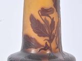 a vase that has a brown and yellow design on it