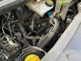 the engine compartment of a car with the hood open