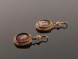 pair of antique gold - plated earrings with miniature portraits of children