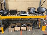 many laptops and other electronic equipment in a warehouse