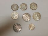 a lot of coins that are sitting on a table