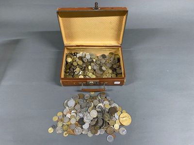 a suitcase full of coins sitting on a table