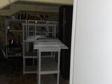 a white refrigerator in a room with a brick wall