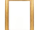 a gold frame on a white wall with a white background