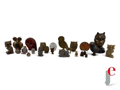 many different types of figurines displayed on a white surface