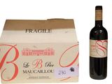 a bottle of wine sitting next to a box of wine