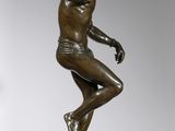 an image of a bronze statue of a man on a pedestal