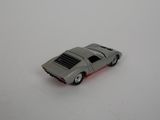 a toy car that is sitting on a white surface