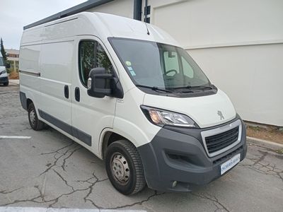 a white van that is parked in a parking lot