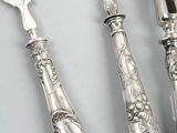 three pieces of silverware including a knife, fork, and spoon