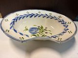 a blue and white bowl sitting on a table