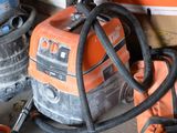 many different types of vacuums in a garage