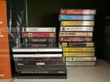 many dvds stacked on top of each other on a shelf