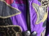 an image of a purple jacket with a colorful design on it