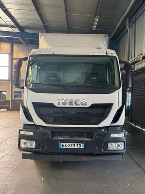 a white truck that is parked in a garage