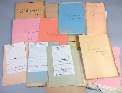 many papers with writing on them on a table