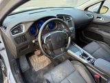 the interior of a car with a steering wheel and dashboard controls