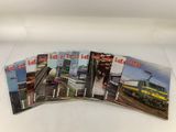 five books of trains on display on a white surface