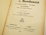 an old book opened to a page with a picture of a bird on it