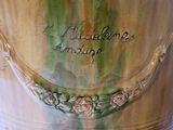 a close up of a vase with writing on it