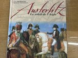 une image représentant un livre sur lequel figure une illustration d'un groupe d'hommes à cheval